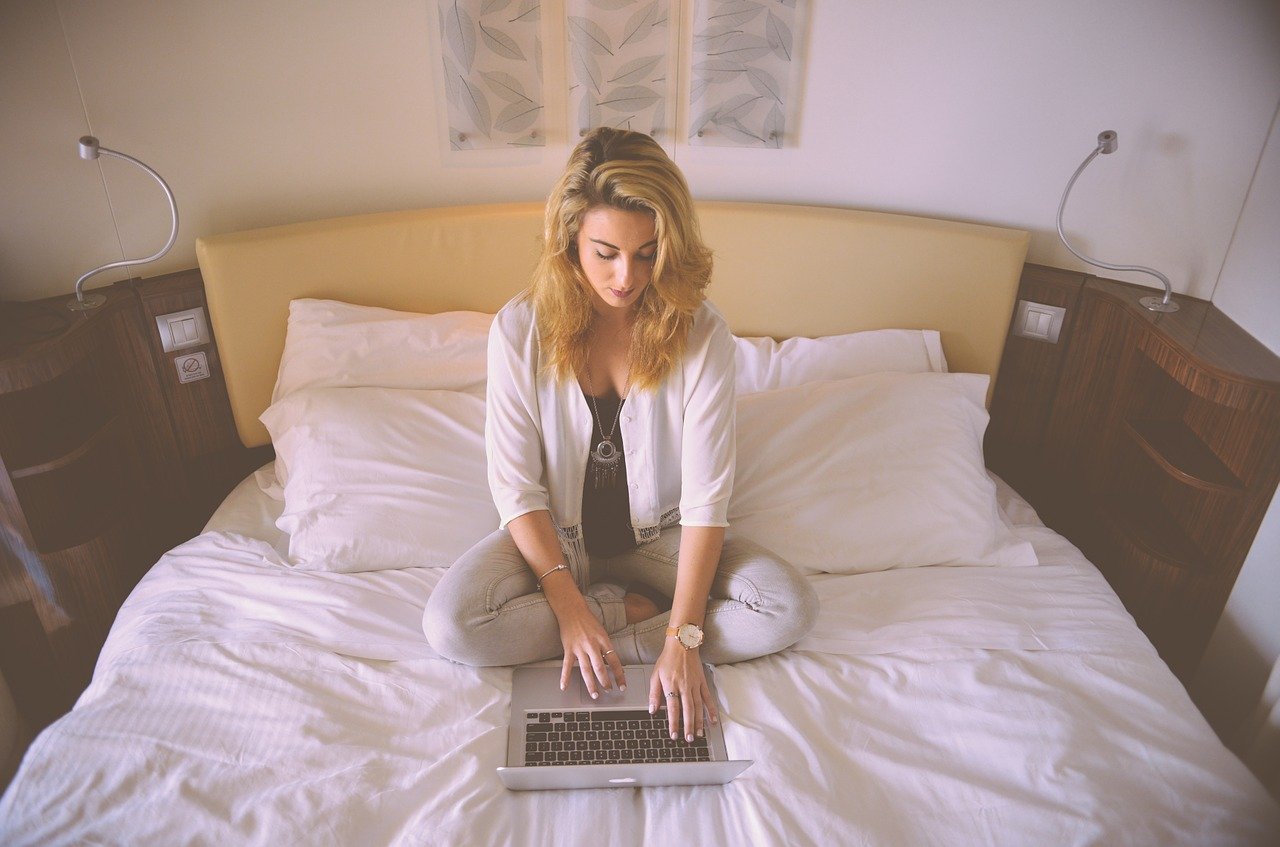 sitting on a bed